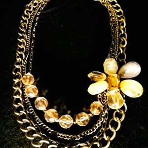 Gold Layered Statement Necklace With Jeweled Flower Attached